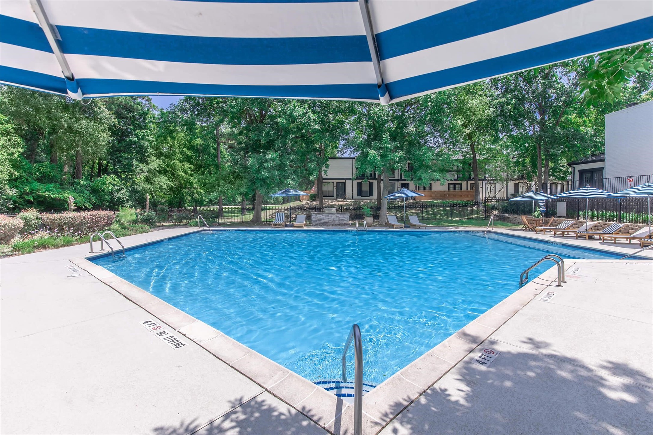 18001 Cypress Trace Road, Unit 506 Houston, TX 77090 - Photo 21 of 32 a view of a swimming pool with a balcony