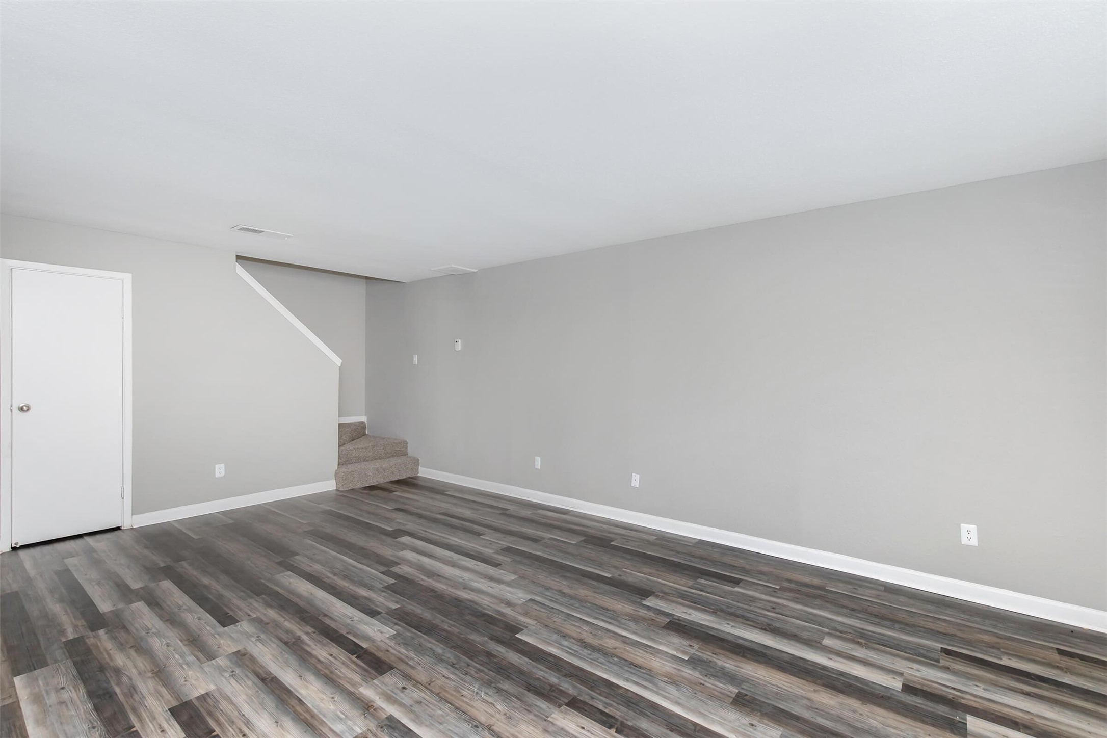 18001 Cypress Trace Road, Unit 506 Houston, TX 77090 - Photo 4 of 32 a view of room with wooden floor