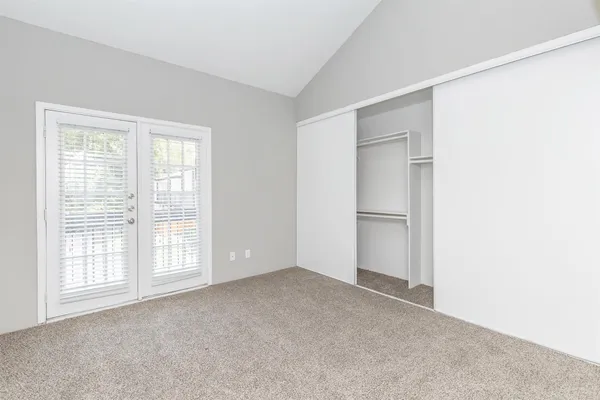 a view of an empty room with a window