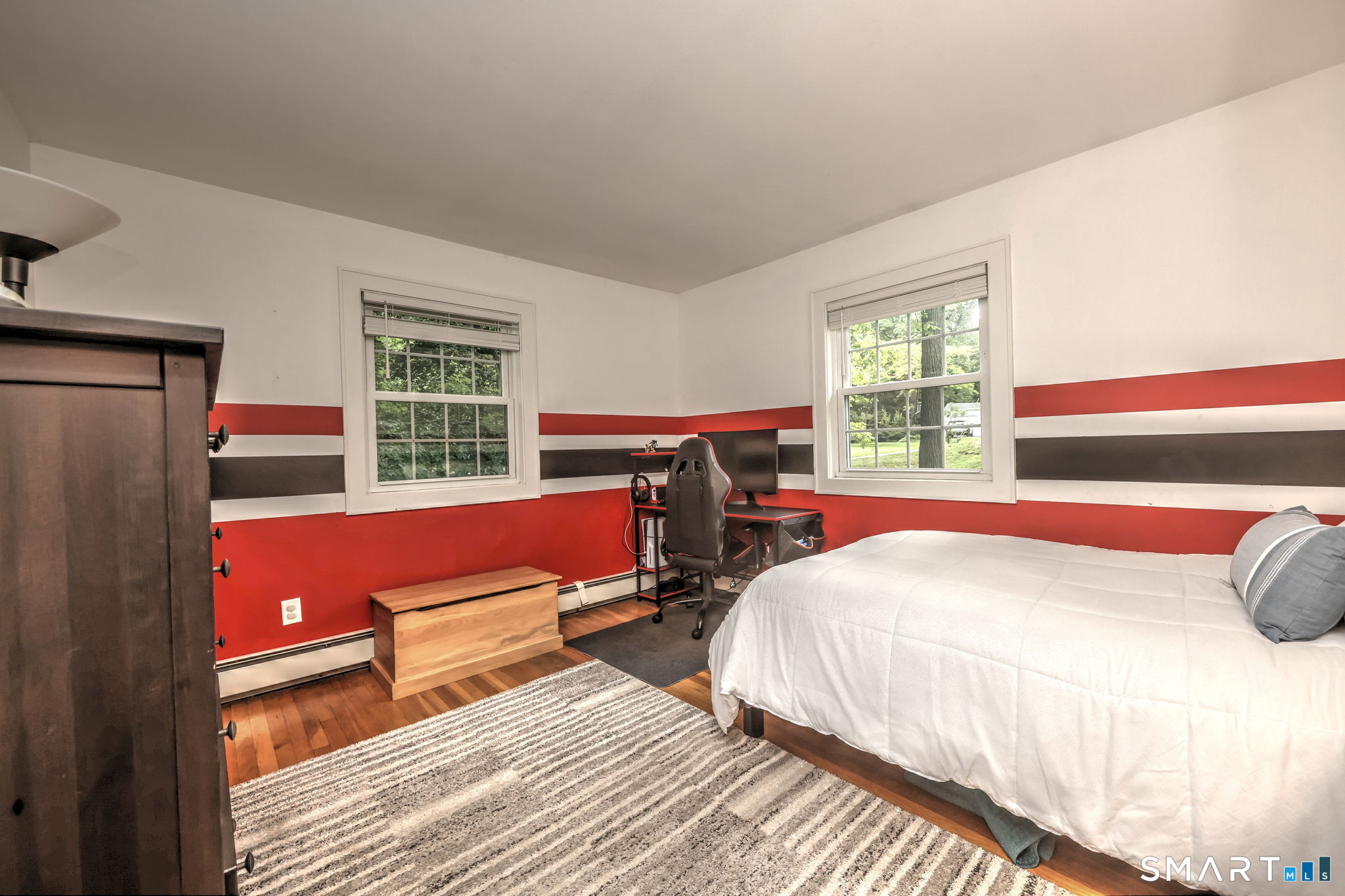 265 Shelter Rock Road Fairfield, CT 06825 - Photo 17 of 32 Large bedroom with hardwood flooring.