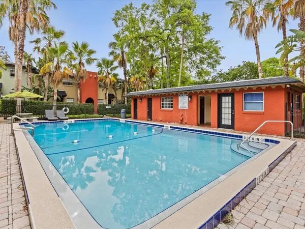 a view of swimming pool with a patio