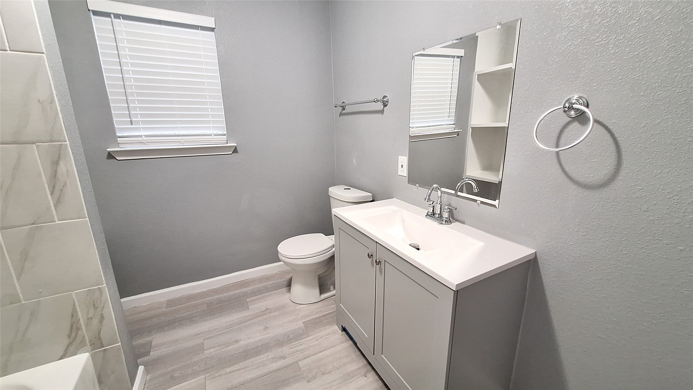 601 Armstrong Somerville, TX 77879 - Photo 13 of 28 a bathroom with a toilet sink and mirror