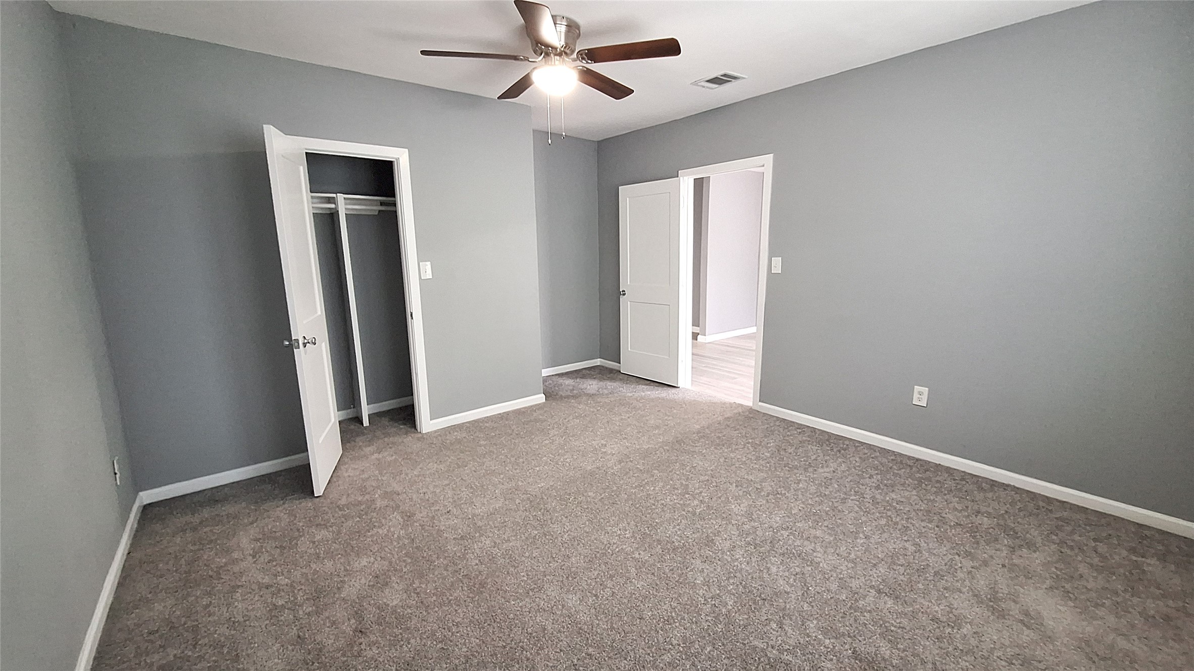 601 Armstrong Somerville, TX 77879 - Photo 16 of 28 an empty room with closet and a ceiling fan