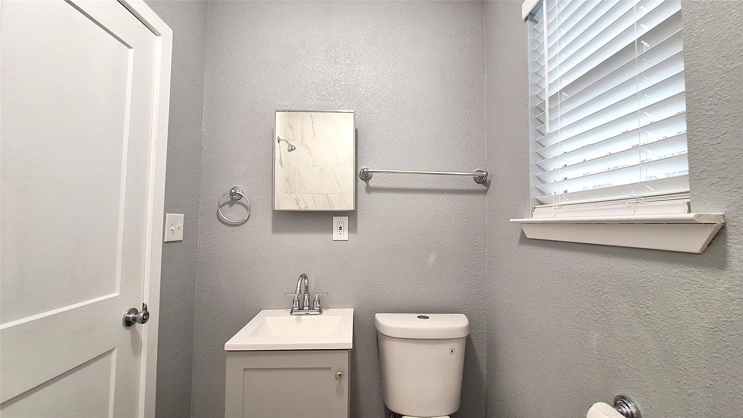 601 Armstrong Somerville, TX 77879 - Photo 19 of 28 a bathroom with a toilet sink and mirror