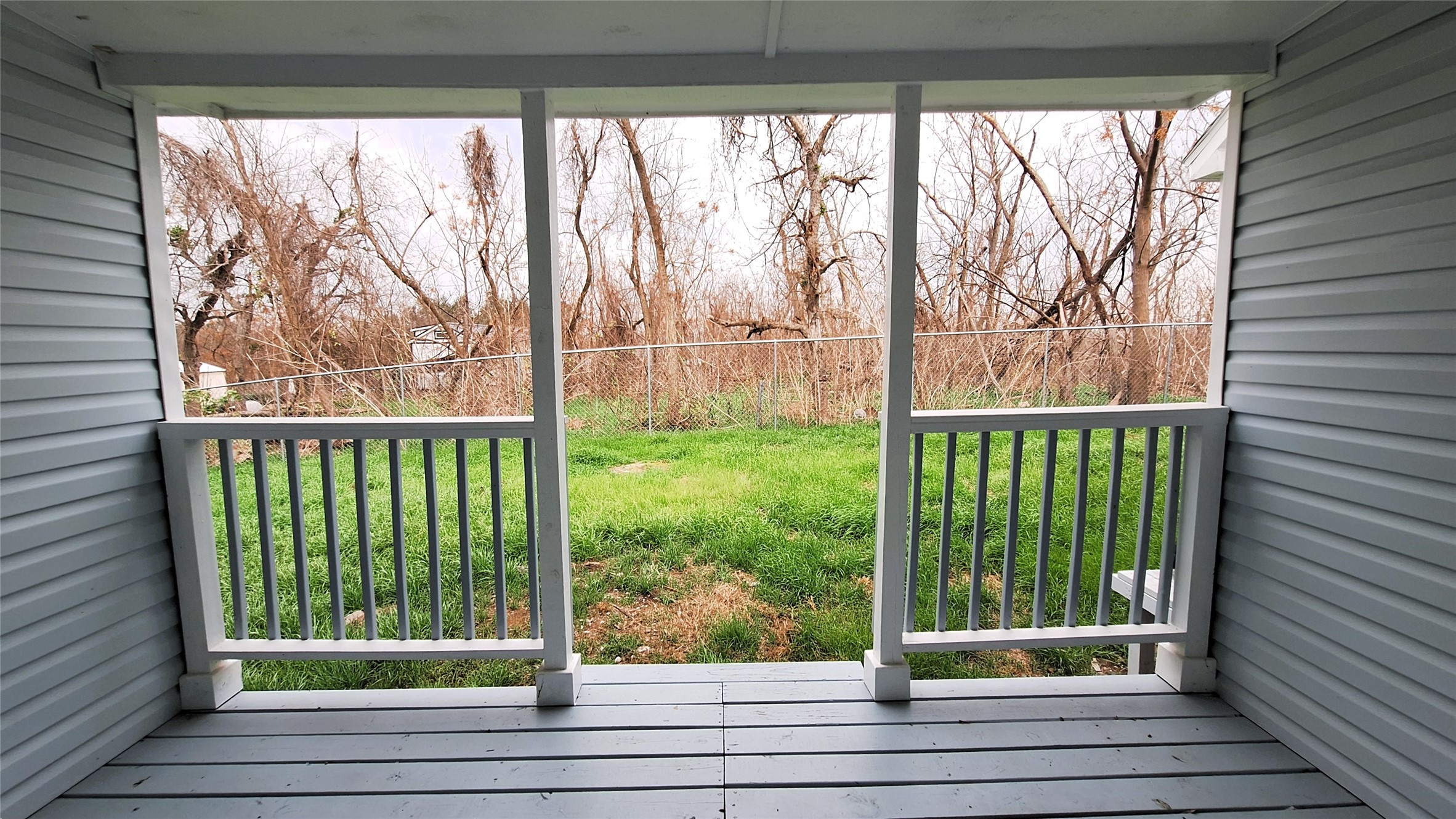 601 Armstrong Somerville, TX 77879 - Photo 22 of 28 a view of a glass door with a trees in a yard