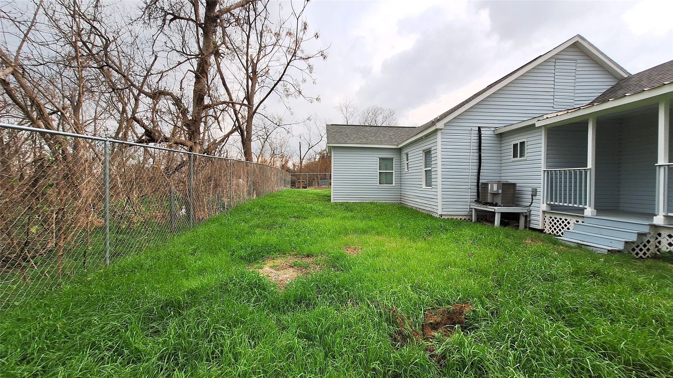 601 Armstrong Somerville, TX 77879 - Photo 25 of 28 a view of a house with backyard and a tree