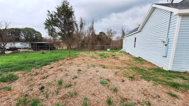 a backyard of a house with lots of green space