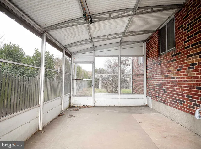 a view of a room with wooden walls