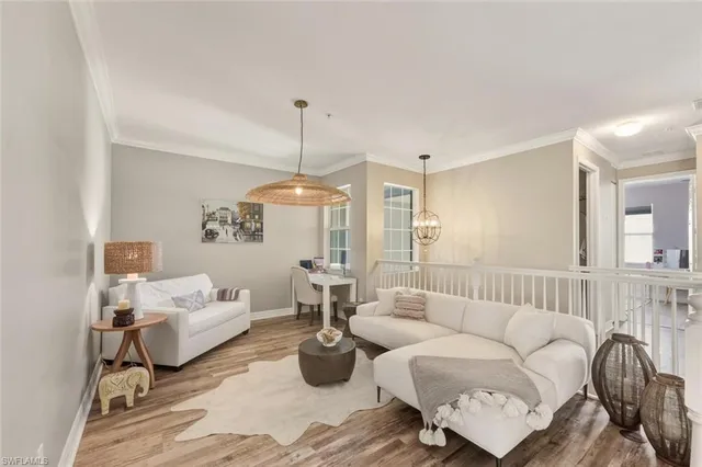 a kitchen with stainless steel appliances kitchen island granite countertop a refrigerator and a stove top oven