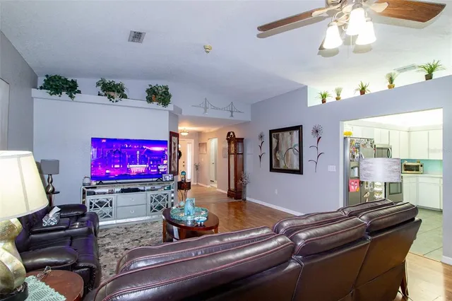 a room with furniture and flat screen tv