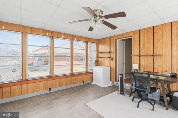 a living room filled with furniture and a large window
