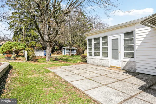 a house with trees in the background