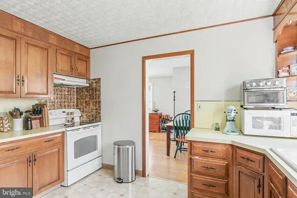 a kitchen with a sink cabinets and appliances