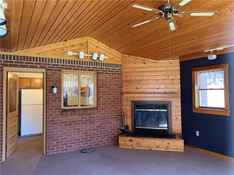 110 Thorne Road Washington, PA 15301 - Photo 3 of 25 Beautiful knotty pine featured in this large 14x19 family room. Door to the left enters into the kitchen.