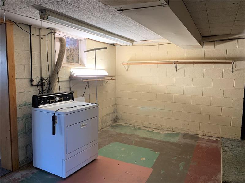 110 Thorne Road Washington, PA 15301 - Photo 21 of 25 Large laundry area. Washer and washtub are to the left of the dryer.