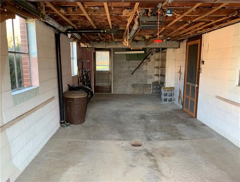 110 Thorne Road Washington, PA 15301 - Photo 23 of 25 Integral garage with a door to the backyard in background.