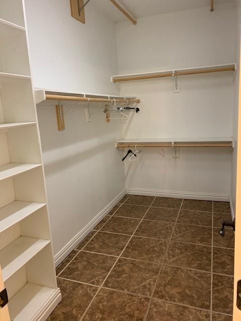 Unfurnished office with built in desk and ornamental molding