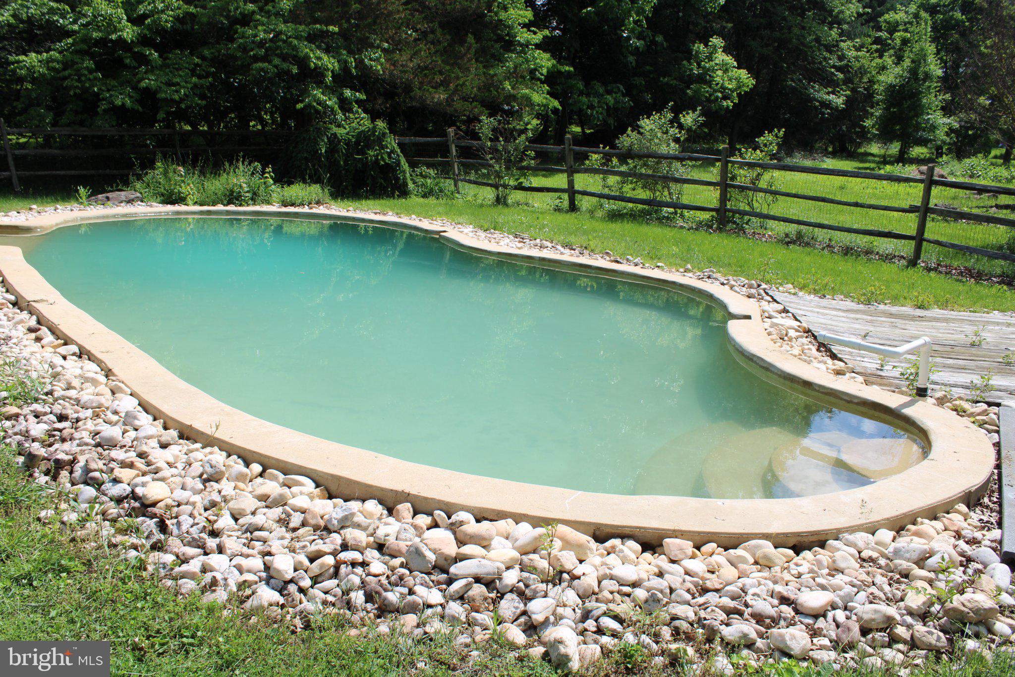 223 Trythall Road Elverson, PA 19520 - Photo 75 of 78 a view of a swimming pool with a yard