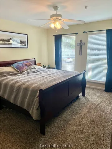 a bedroom with a bed and window