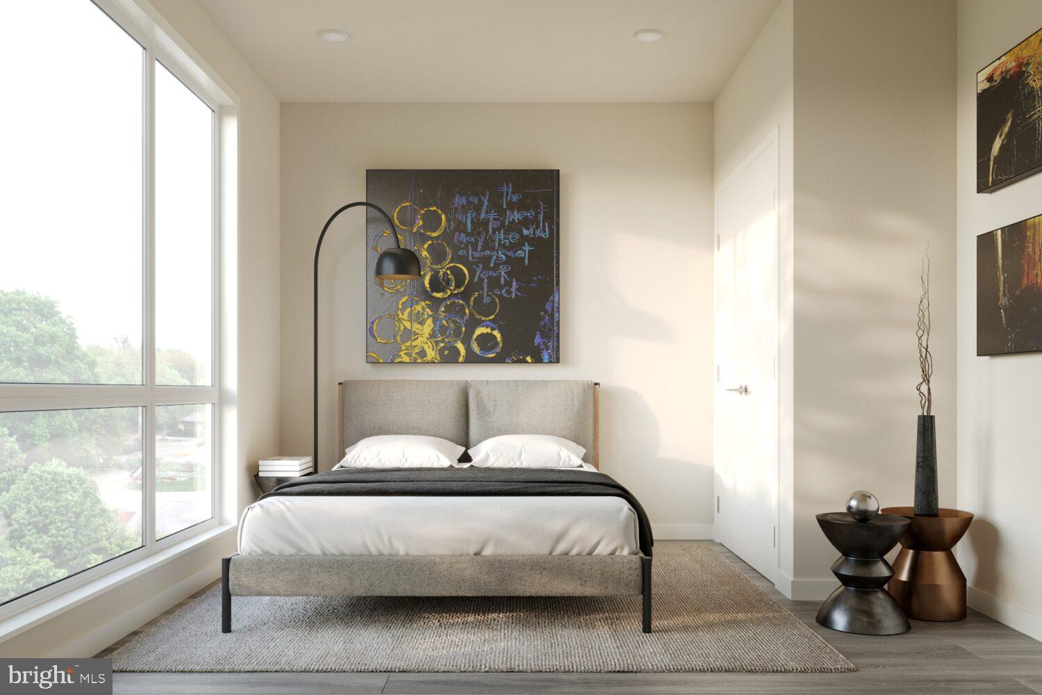 1314 Spring Garden Street, Unit 512 Philadelphia, PA 19123 - Photo 12 of 26 a bedroom with a bed and wooden floor