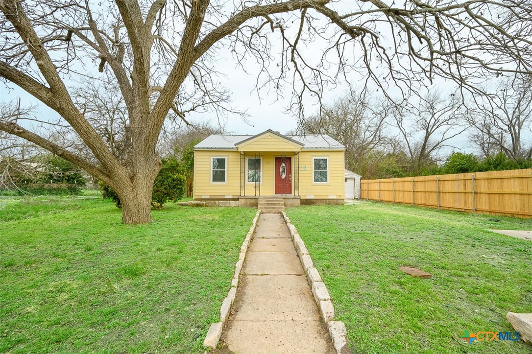 1010 South 4th Street Temple, TX 76504 - Photo 15 of 19 a front view of a house with yard