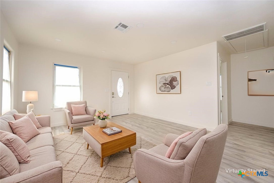 1010 South 4th Street Temple, TX 76504 - Photo 2 of 19 a living room with furniture and a window