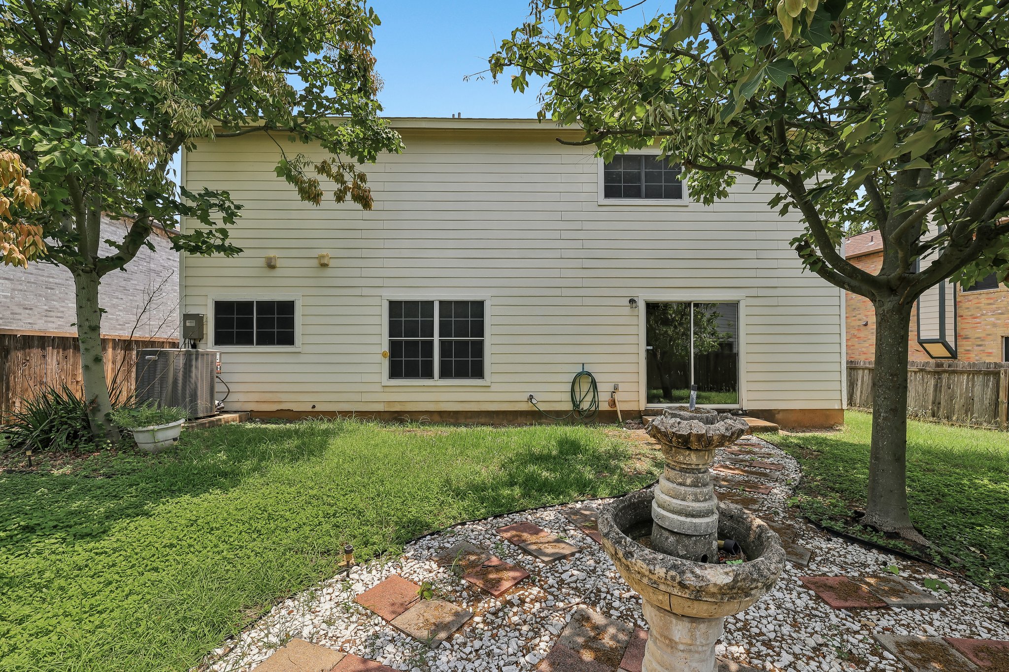 7658 Marble Ridge Drive Austin, TX 78747 - Photo 30 of 34 a front view of a house with garden