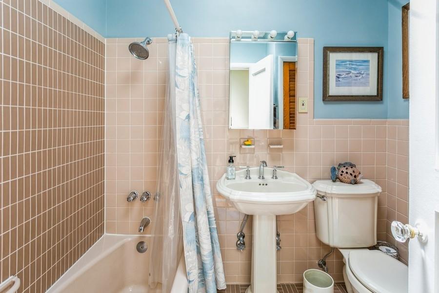 8917 Ridge Boulevard Brooklyn, NY 11209 - Photo 17 of 24 a bathroom with a sink toilet and shower