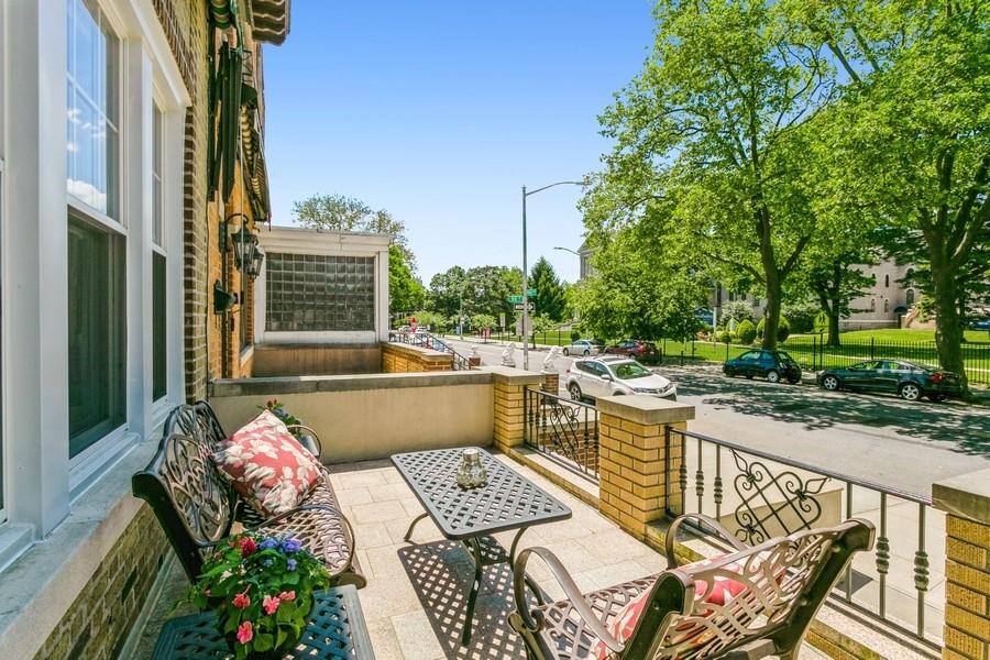8917 Ridge Boulevard Brooklyn, NY 11209 - Photo 4 of 24 a view of a patio with couches table and chairs and potted plants