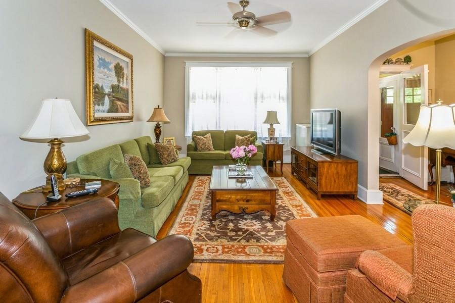 8917 Ridge Boulevard Brooklyn, NY 11209 - Photo 6 of 24 a living room with furniture and a flat screen tv