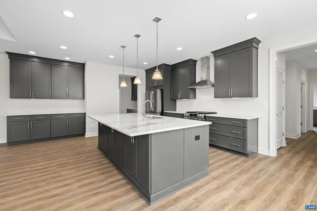 a kitchen with a sink a refrigerator and a window