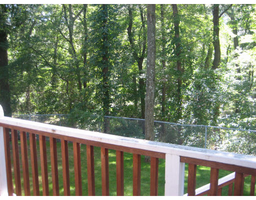 60 Tanglewood Road, Unit 60 Newton, MA 02459 - Photo 11 of 11 a view of a wooden fence from a balcony