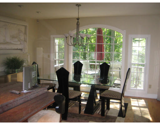 60 Tanglewood Road, Unit 60 Newton, MA 02459 - Photo 4 of 11 a view of a dining room with furniture and window