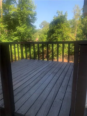 a view of wooden deck and a garden