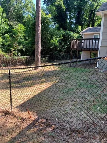 a view of a yard with a tree