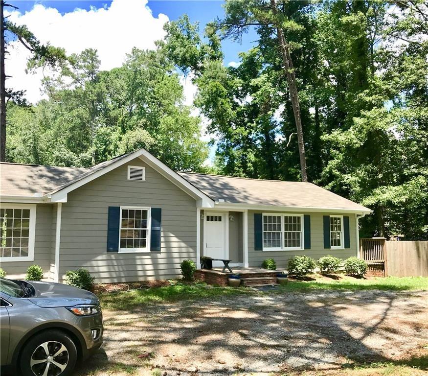 722 Level Creek Road Sugar Hill, GA 30518 - Photo 2 of 18 a front view of a house with a yard