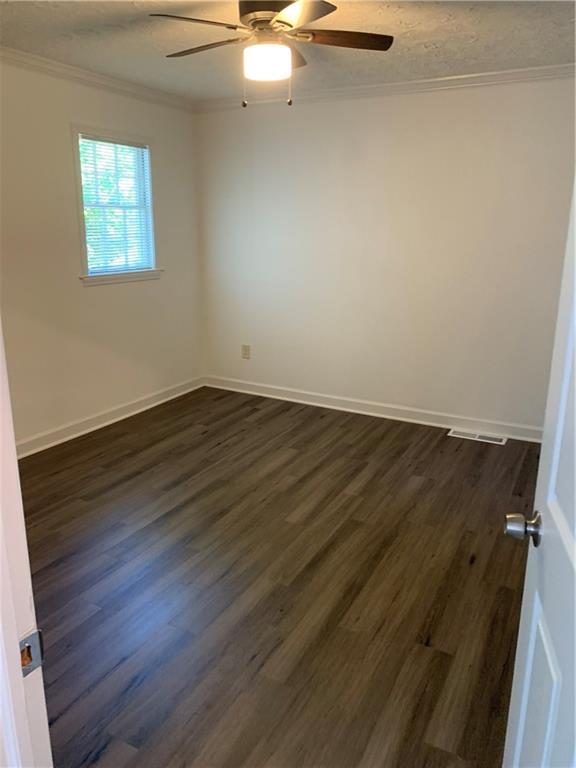 722 Level Creek Road Sugar Hill, GA 30518 - Photo 8 of 18 an empty room with wooden floor and windows