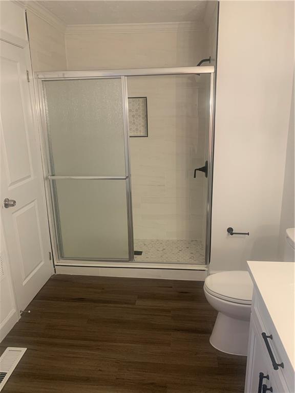 722 Level Creek Road Sugar Hill, GA 30518 - Photo 10 of 18 a bathroom with a shower a toilet and sink