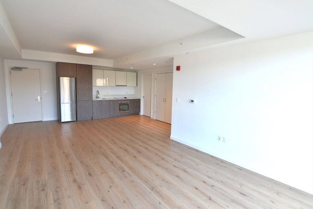 1282 Boylston Street, Unit 511 Boston, MA 02215 - Photo 11 of 18 a view of a kitchen with wooden floor and a sink