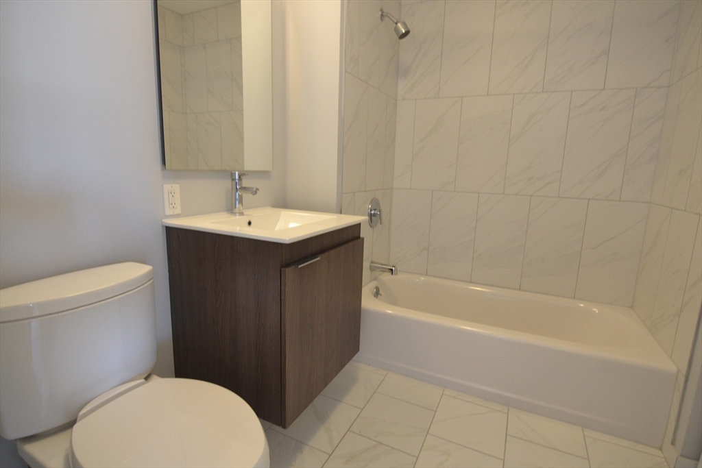 1282 Boylston Street, Unit 511 Boston, MA 02215 - Photo 14 of 18 a bathroom with a sink a toilet and bathtub