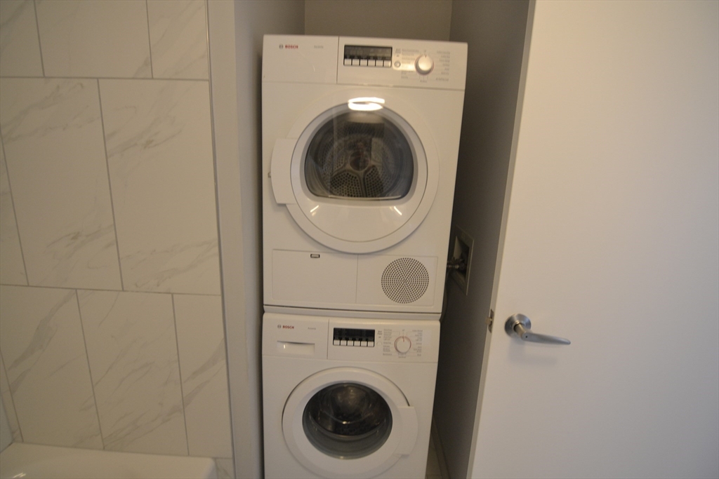1282 Boylston Street, Unit 511 Boston, MA 02215 - Photo 15 of 18 a utility room with dryer and washer