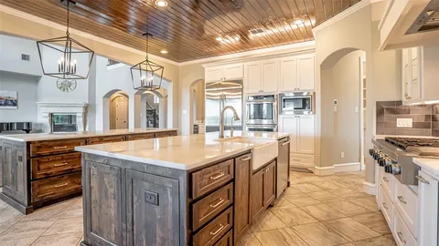 a kitchen with stainless steel appliances granite countertop a stove and a sink