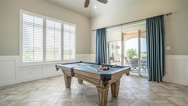 a dining room with a large window and table
