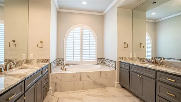 a bathroom with a bathtub and a shower