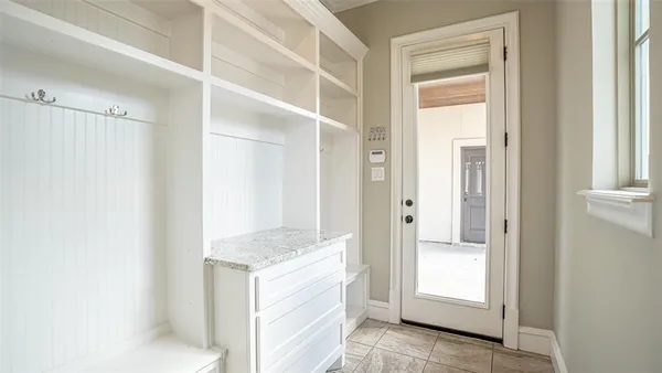 a kitchen with a refrigerator and a sink