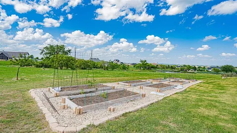 an aerial view of a house with outdoor space
