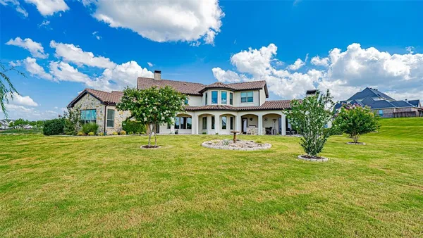 an aerial view of a house with outdoor space