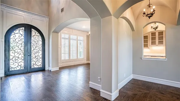 a view of an entryway with wooden floor