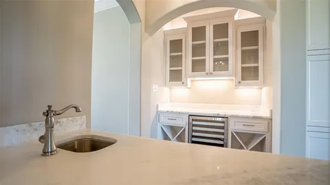 a kitchen with a sink and a window