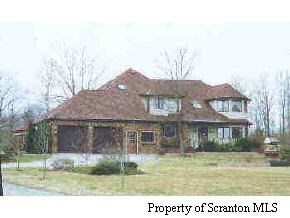 1 Golf Club Road Moscow, PA 18436 - Photo 1 of 5 a house view with a garden space